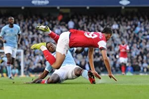 Manchester City v Arsenal 2010-11 Collection: Marouane Chamakh is tripped by Man City defender Dedryck. Manchester City 0: 3 Arsenal