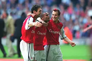 Martin Keown, Ashley Cole and Fredrik Ljungberg celebrate after the match
