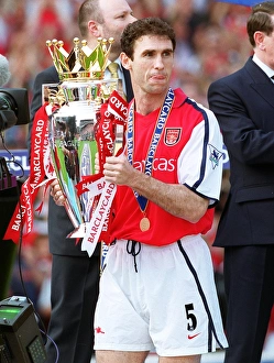 Martin Keown with the F. A. Barclaycard Premiership Trophy
