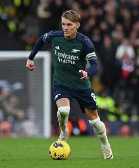 Images Dated 31st December 2023: Martin Odegaard in Action: Fulham vs. Arsenal, Premier League 2023-24