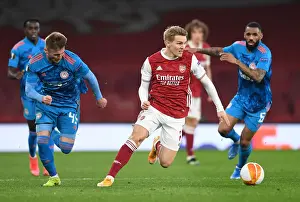 Martin Odegaard Alone: Arsenal's Emirates Stadium Showdown Against Olympiacos in Empty Europa League Arena