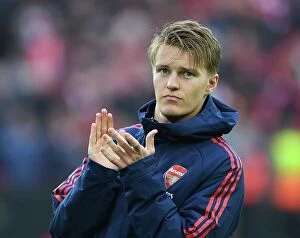 Liverpool v Arsenal 2022-23 Collection: Martin Odegaard Applauds Arsenal Fans at Anfield After Liverpool Clash (2022-23)