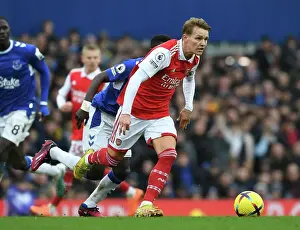 Martin Odegaard Breaks Past Everton's Idrissa Gana Gueye in Thrilling Arsenal vs Everton Clash (Premier League 2022-23)