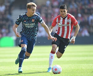 Images Dated 16th April 2022: Martin Odegaard Breaks Past Mohamed Elyounoussi: Southampton vs Arsenal, Premier League 2021-22