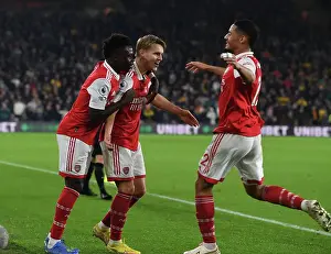 Martin Odegaard and Team Celebrate First Goal: Wolverhampton Wanderers vs. Arsenal FC, Premier League 2022-23