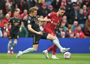 Martin Odegaard vs. Jordan Henderson: A Premier League Battle at Anfield, 2022-23