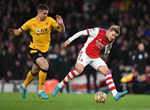 Arsenal V Wolverhampton Wanderers 2021-22 Prints: Martin Odegaard vs. Leander Dendoncker: Intense Rivalry in Arsenal vs