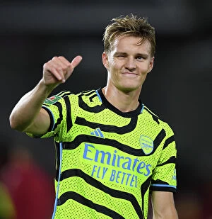 Images Dated 28th September 2023: Martin Odegaard's Emotional Reaction: Arsenal Advance in Carabao Cup, Overcome Brentford, 2023-24