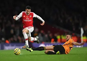Martinelli Foul: Arsenal's Star Forward Halted by Saiss in Arsenal vs. Wolverhampton Clash (2019-20)