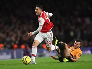 Martinelli Foul: Arsenal's Star Forward Halted by Saiss in Arsenal vs. Wolverhampton Clash (2019-20)
