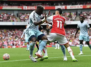Martinelli Stands Firm: Arsenal's Battle with Forest's Aurier and Danilo (2023-24 Premier League)