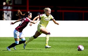 West Ham United Women v Arsenal Women 2021-22 Collection: Mead vs Hasegawa: A Thrilling Showdown in the FA WSL Clash Between West Ham and Arsenal