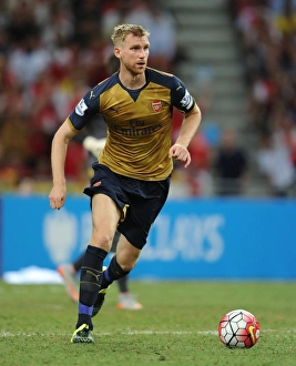 Arsenal V Singapore XI Prints: Per Mertesacker in Action: Arsenal vs. Singapore XI, Barclays Asia Trophy (July 15, 2015)