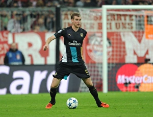 Bayern Munich V Arsenal 2015-16 Prints: Per Mertesacker in Action: Arsenal vs Bayern Munich, UEFA Champions League (2015-16)