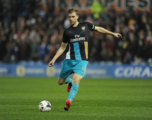 Sheffield Wednesday V Arsenal - Capital One Cup 2015-16 Prints: Per Mertesacker in Action: Arsenal's Defensive Battle at Sheffield Wednesday (Capital One Cup 2015-16)
