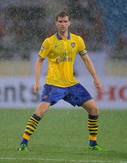 Vietnam V Arsenal 2013-14 Prints: Per Mertesacker in Action: Vietnam vs. Arsenal (2013-14)