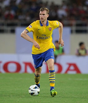 Vietnam V Arsenal 2013-14 Prints: Per Mertesacker in Action: Vietnam vs. Arsenal (2013)