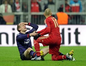 Bayern Munich Collection: Per Mertesacker and Arjen Robben: Unbelievable Moment in the UEFA Champions League Clash between