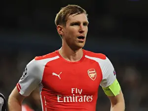 Anderlecht V Arsenal 2014-15 Prints: Per Mertesacker of Arsenal in Action against RSC Anderlecht in the 2014-15 UEFA Champions League
