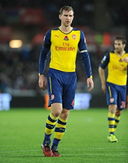Per Mertesacker of Arsenal in Action against Swansea City (2014-15)