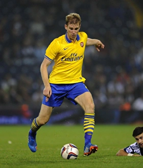 West Bromwich Albion V Arsenal 2013-14 - Capital Cup Prints: Per Mertesacker of Arsenal in Action against West Bromwich Albion - Capital One Cup, 2013