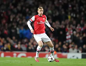 Arsenal V Marseille 2013-14 Prints: Per Mertesacker (Arsenal). Arsenal 2: 0 Olympic Marseille. UEFA Champions League. Group F