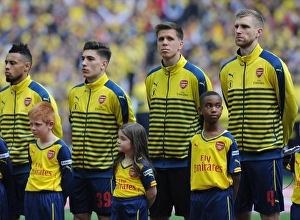 Per Mertesacker (Arsenal) with the Arsenal Mascot before the match. Arsenal 4:0 Aston Villa Per Mertesacker (Arsenal) with the Arsenal Mascot before the match. Arsenal 4:0 Aston Villa