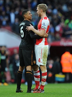 Per Mertesacker (Arsenal) Curtis Davies (Hull). Arsenal 2:2 Hull City. Barclays Premier League Per Mertesacker (Arsenal) Curtis Davies (Hull). Arsenal 2:2 Hull City. Barclays Premier League