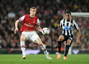 Images Dated 28th April 2014: Per Mertesacker (Arsenal) Loic Remy (Newcastle). Arsenal 2: 0 Newcastle United. Barclays