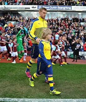 Burnley V Arsenal 2014/15 Prints: Per Mertesacker and the Arsenal Mascot: Sharing a Pre-Match Moment at Burnley, 2015