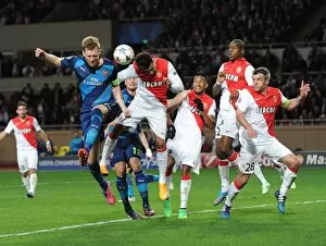 Monaco v Arsenal 2014/15 Collection: Per Mertesacker (Arsenal) Nabil Dirar (Monaco). AS Monaco 0: 2 Arsenal. UEFA Champions League