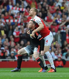 Per Mertesacker (Arsenal) Wayne Rooney (Man Utd)