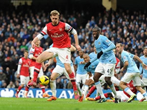 Images Dated 14th December 2013: Per Mertesacker (Arsenal) Yaya Toure (Man City). Manchester City 6: 3 Arsenal. Barclays