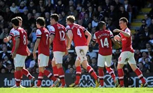 Images Dated 20th April 2013: Per Mertesacker celebrates scoring his goal for Arsenal with his team mates. Fulham 0: 1 Arsenal