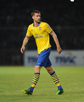 Indonesia Dream Team V Arsenal 2013-14 Prints: Per Mertesacker Faces Indonesia All-Stars in 2013