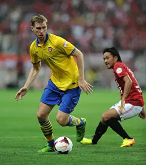 Uwara Red Diamonds V Arsenal 2013-14 Prints: Per Mertesacker Faces Off Against Shinzo Koroki in Arsenal's 2013 Pre-Season Clash with Urawa Red Diamonds