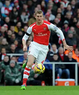 Per Mertesacker Focuses in Arsenal's Battle Against Stoke City (2014-15)
