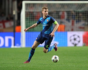 Monaco V Arsenal 2014/15 Prints: Per Mertesacker Focuses in Monaco Showdown: Arsenal vs