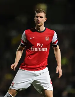Norwich City V Arsenal 2012-13 Prints: Per Mertesacker Focuses in Norwich City vs Arsenal Premier League Clash (2012)