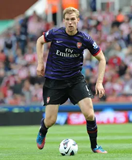 Per Mertesacker Focuses in Stoke City vs Arsenal Premier League Clash (2012-13)