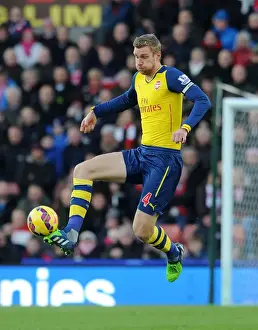 Per Mertesacker Focuses in Stoke City vs Arsenal Premier League Clash (2014-15)