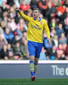 Stoke City V Arsenal 2013-14 Prints: Per Mertesacker Focuses in Stoke City vs Arsenal Premier League Clash