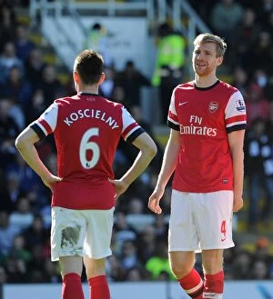 Images Dated 20th April 2013: Per Mertesacker with Laurent Koscielny (Arsenal). Fulham 0: 1 Arsenal. Barclays Premier League