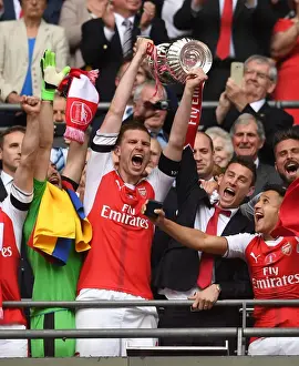 Arsenal V Chelsea - FA Cup Final 2017 Prints: Per Mertesacker and Laurent Koscielny (Arsenal) lift the FA Cup. Arsenal 2: 1 Chelsea