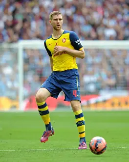 Per Mertesacker Lifts FA Cup: Arsenal's Victory over Aston Villa (4-0) at Wembley, 2015