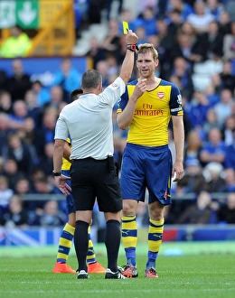Everton V Arsenal 2014/15 Prints: Per Mertesacker Shown Yellow Card in Everton vs. Arsenal Premier League Clash (2014/15)