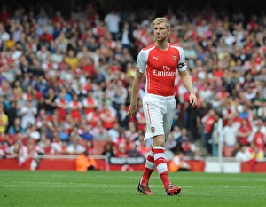 Arsenal V Manchester City 2014-15 Prints: Per Mertesacker: Unwavering Defender in Arsenal vs. Manchester City (2014-15)
