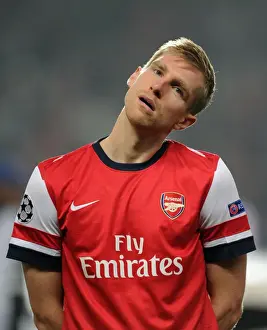 Per Mertesacker: Unyielding Arsenal Defender in UEFA Champions League Clash vs Schalke 04 (2012)