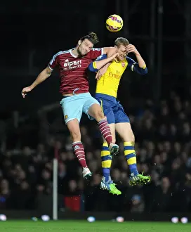 West Ham United V Arsenal 2014-15 Prints: Per Mertesacker vs. Andy Carroll: Intense Clash in West Ham United vs