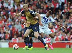 Arsenal V Olympique Lyonnais - Emirates Cup 2015/16 Prints: Per Mertesacker vs. Clinton N'Jie: A Battle at the Emirates Cup